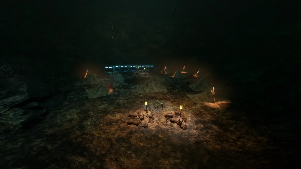 A torch-lit camp on bare rock in the first hours underground, no interface